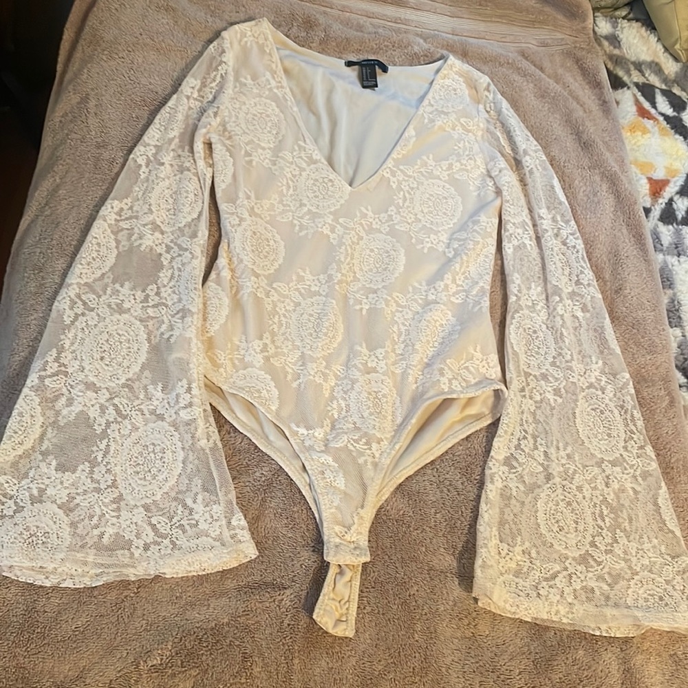 Cream lace bodysuit with long bell skeeves